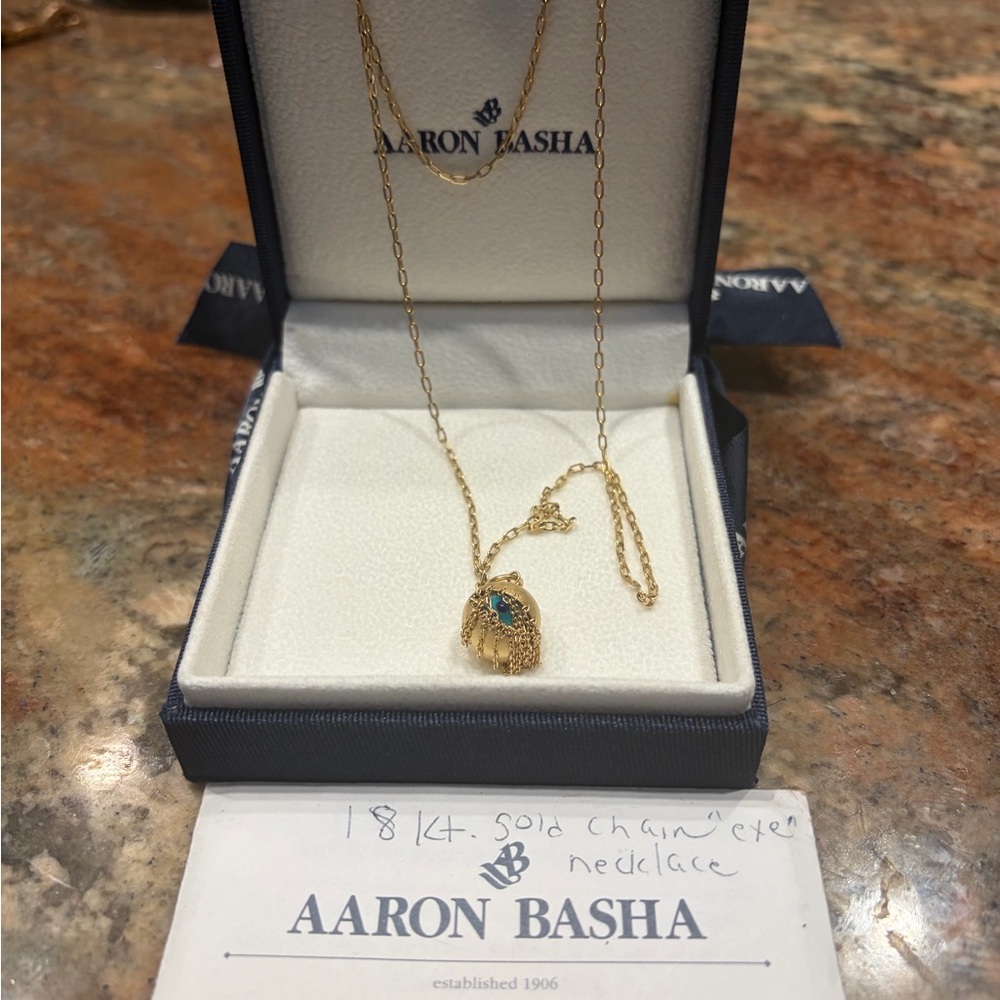 Aaron Basha Fringe Eye charm on 18kt gold necklace.